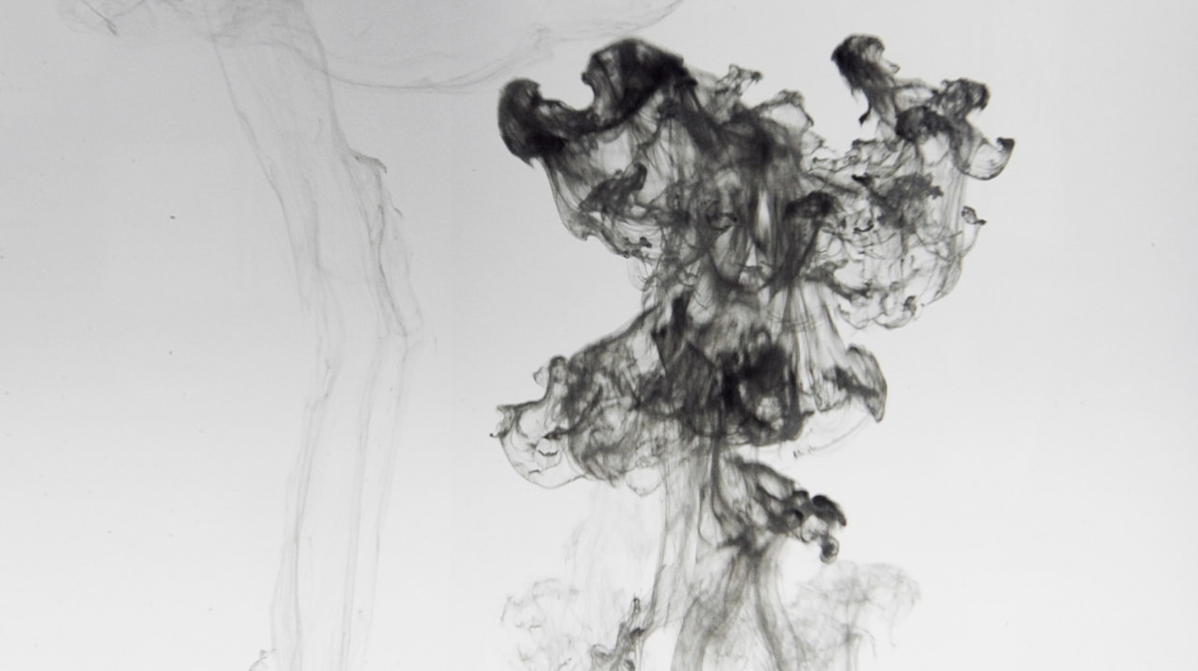 upside down ink tower in water in black and white from live visuals by Claudia Hansen
