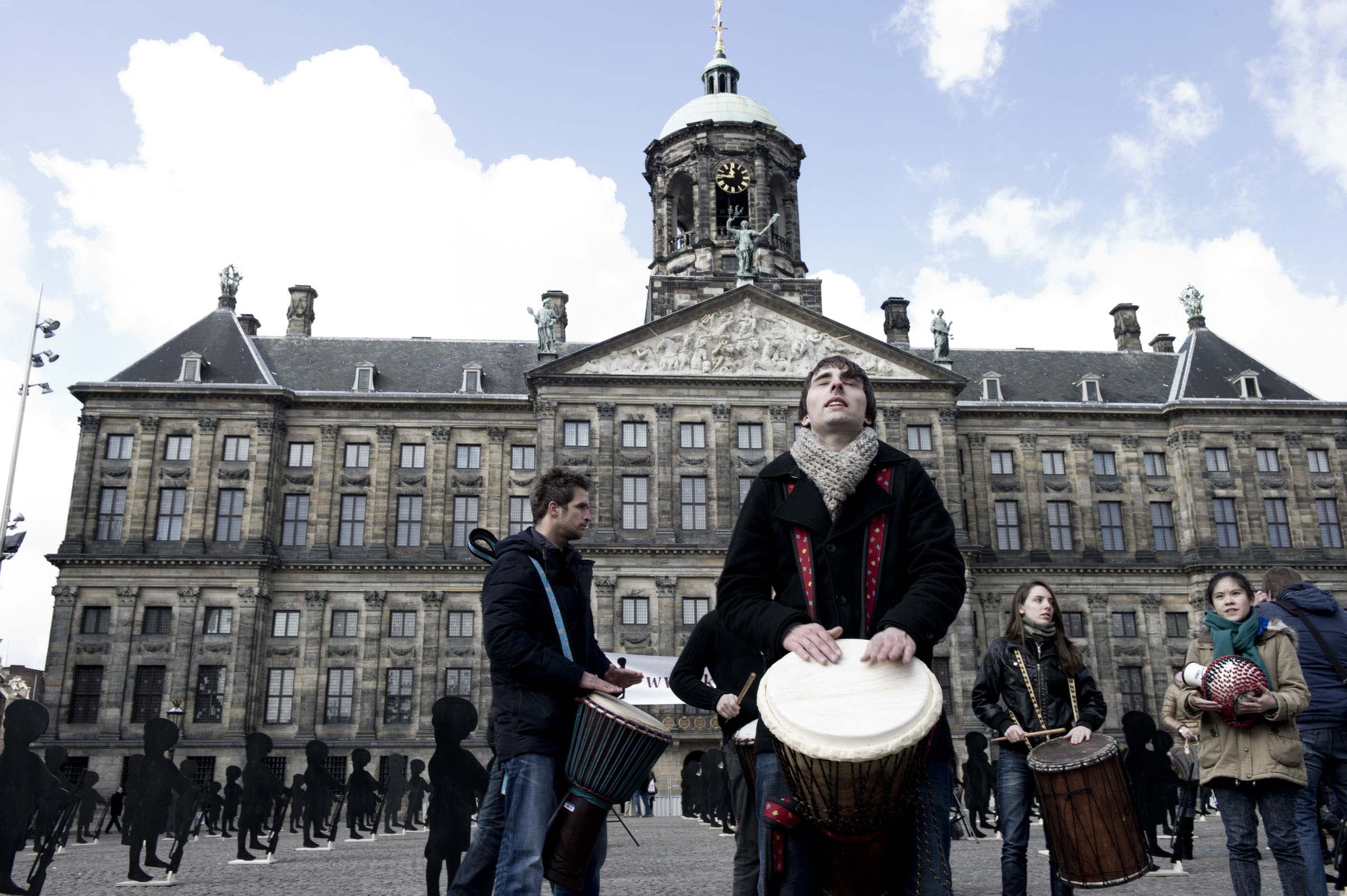 Dominique Vleeshouwers and percussionists playing on the Dam square in Amsterdam