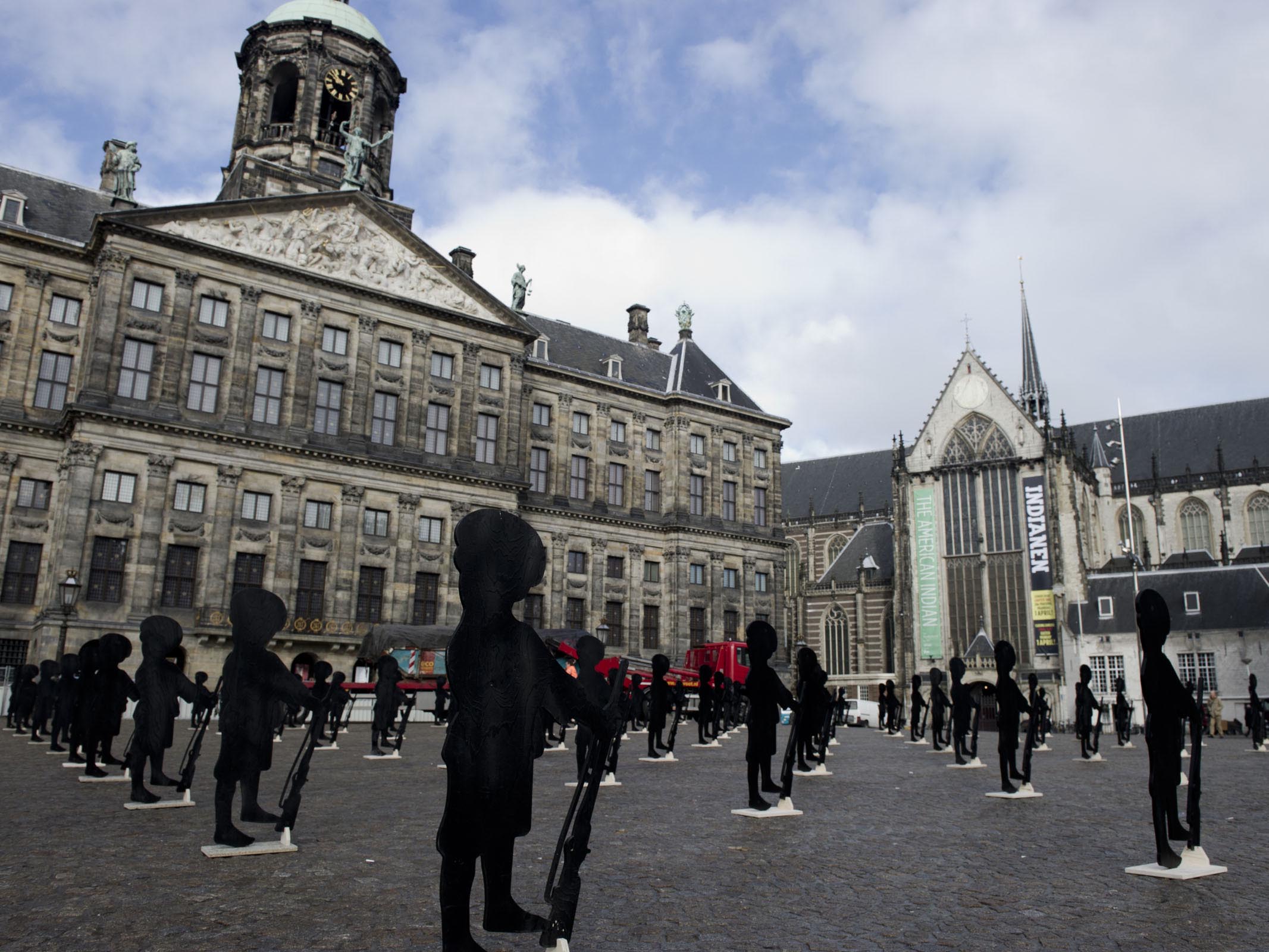 army of child soldier puppets designed by Claudia Hansen on the Amsterdam Dam square