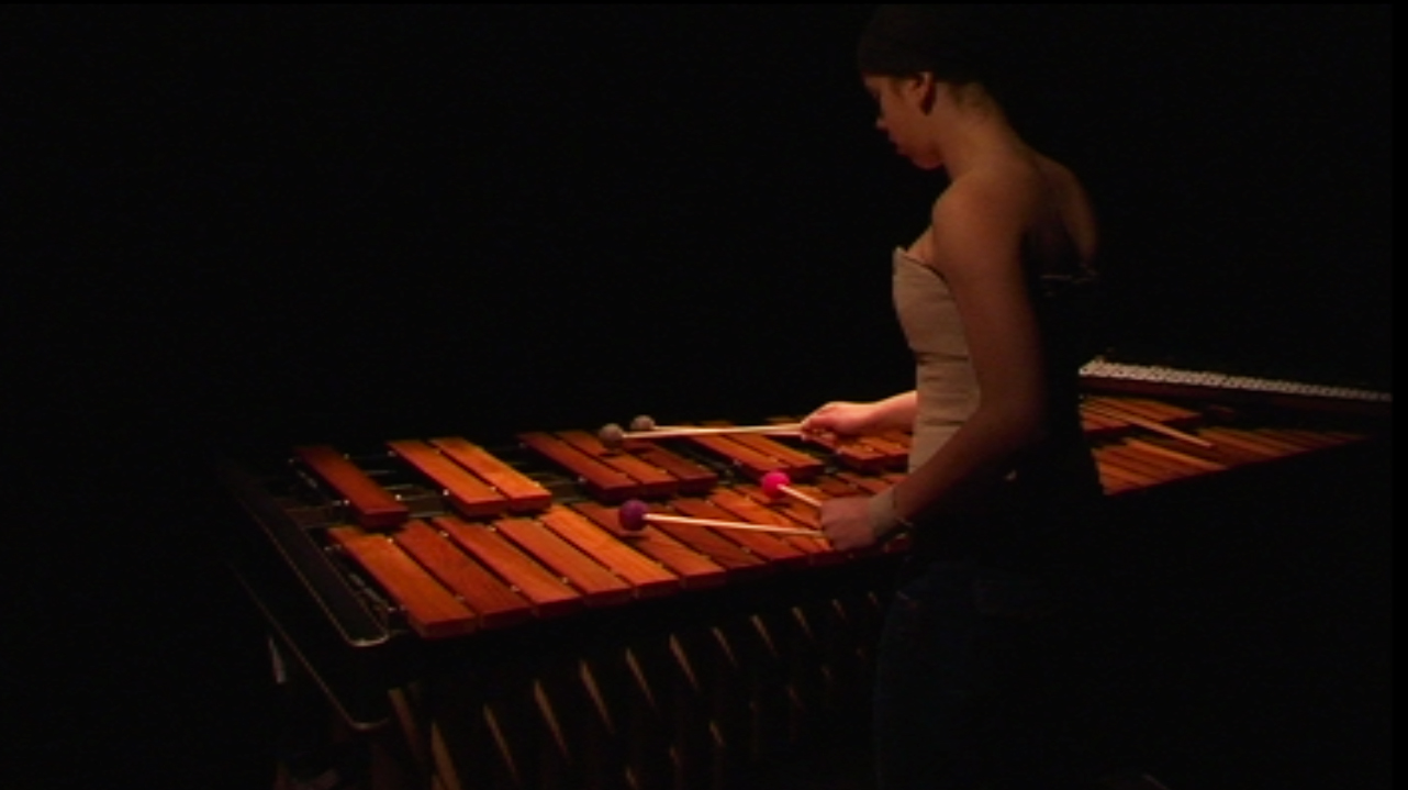 Claudia Hansen playing marimba in the Music Theater performance Depending by Shawn And The Zebra